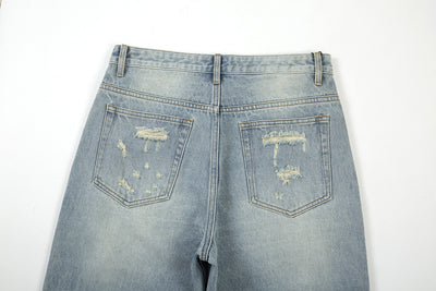 LOOSE WHISKERED DENIM FLARE PANT