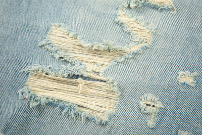 LOOSE WHISKERED DENIM FLARE PANT